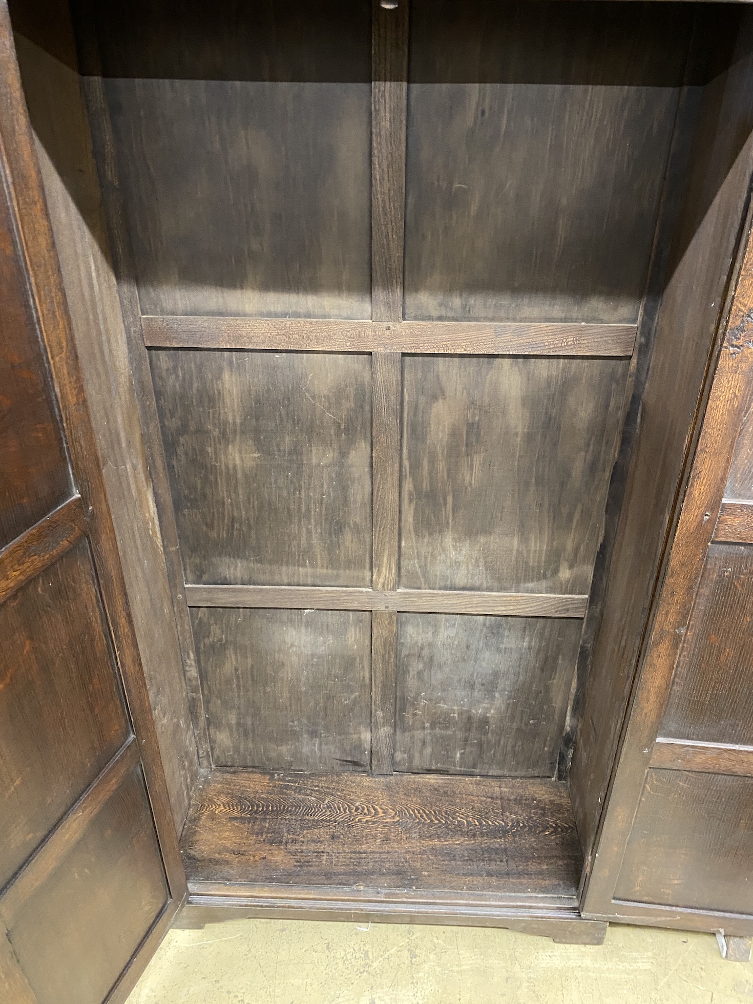 An 18th century style carved oak hall cupboard, width 97cm, depth 35cm, height 179cm